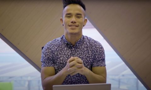  Student sitting and looking directly at camera