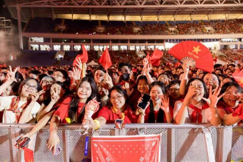 Music concert goers with Vietnamese flags