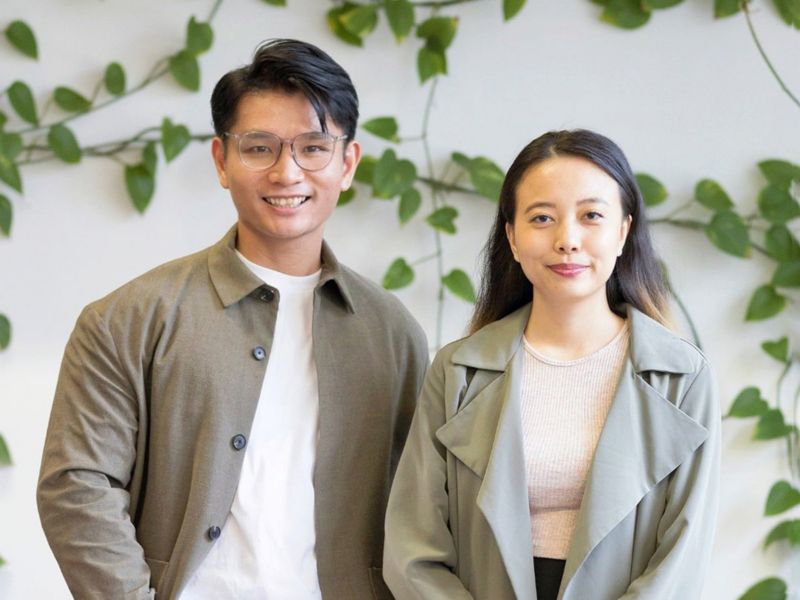 Portrait of a man and a woman wearing olive green clothes