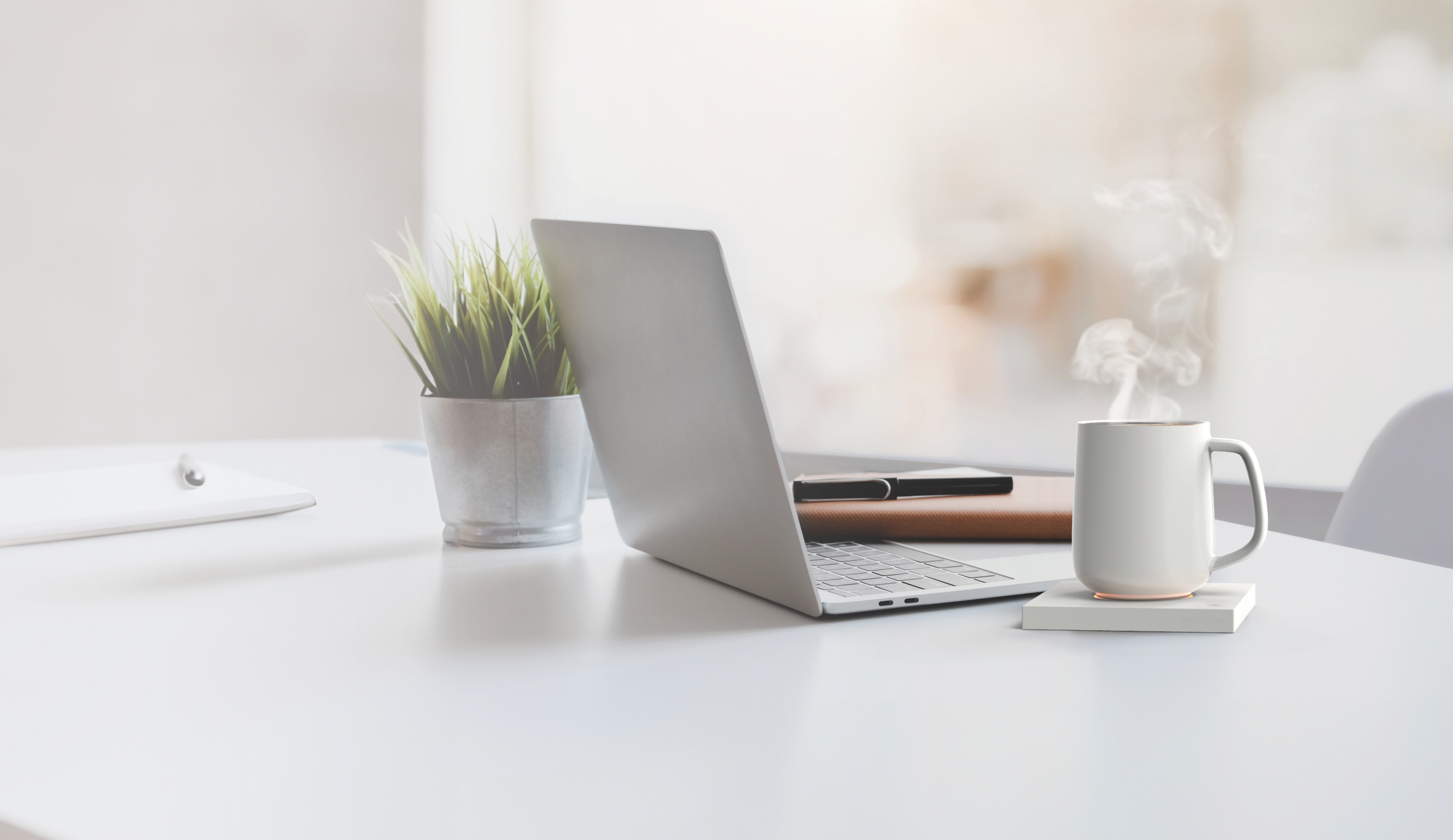 Ceramic mug kept warm on a smart warmer pad, maintaining ideal beverage temperature.