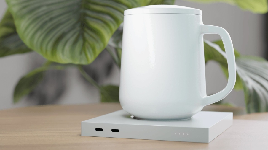 A single white ceramic mug placed on a smart warmer pad.