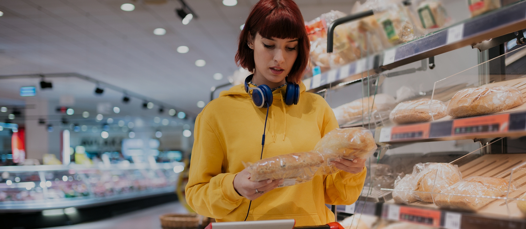 A person selecting items from a mall shelf