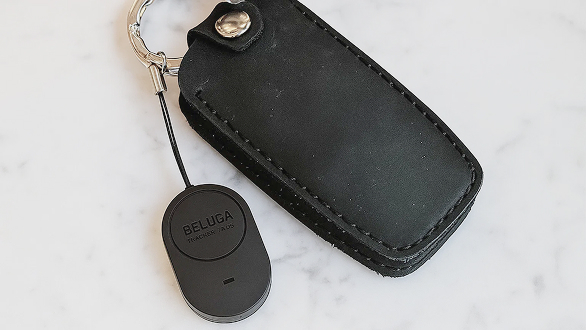 Smart tag clipped to a key case.