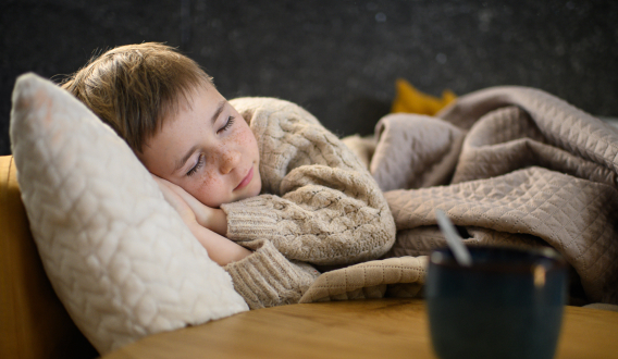 A sleeping child resting peacefully, symbolizing calm and deep sleep.