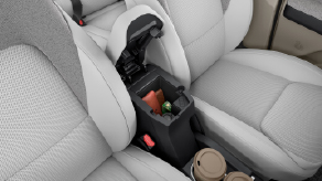 Soft-Touch Leatherette front armrest with storage