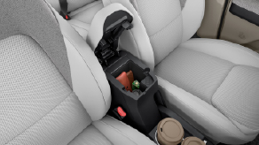 Soft-Touch Leatherette front armrest with storage
