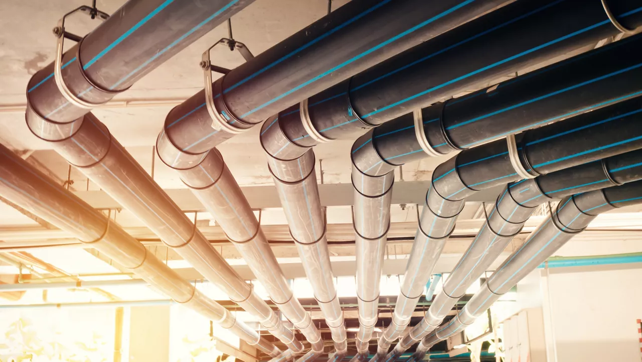 Black manage water pipe, safety and clean watering system in condominium or modern building construction.