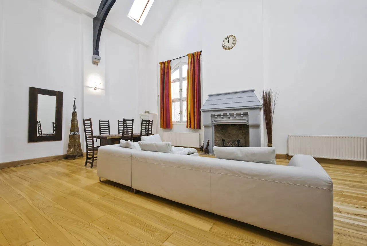 living room interior with double height ceiling and roof windows