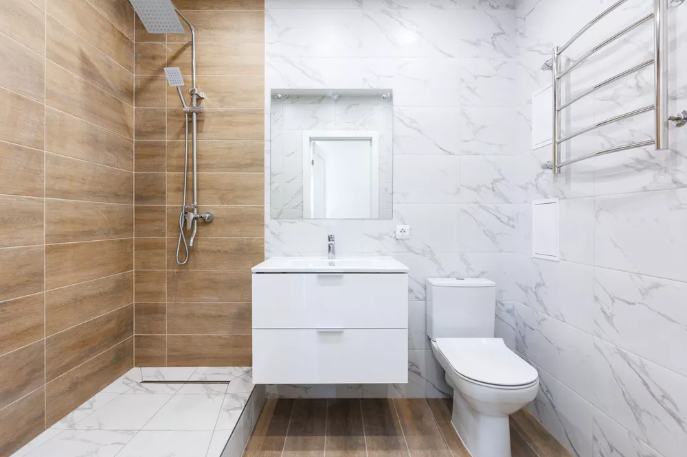 modern bathroom room with toilet and washing machine