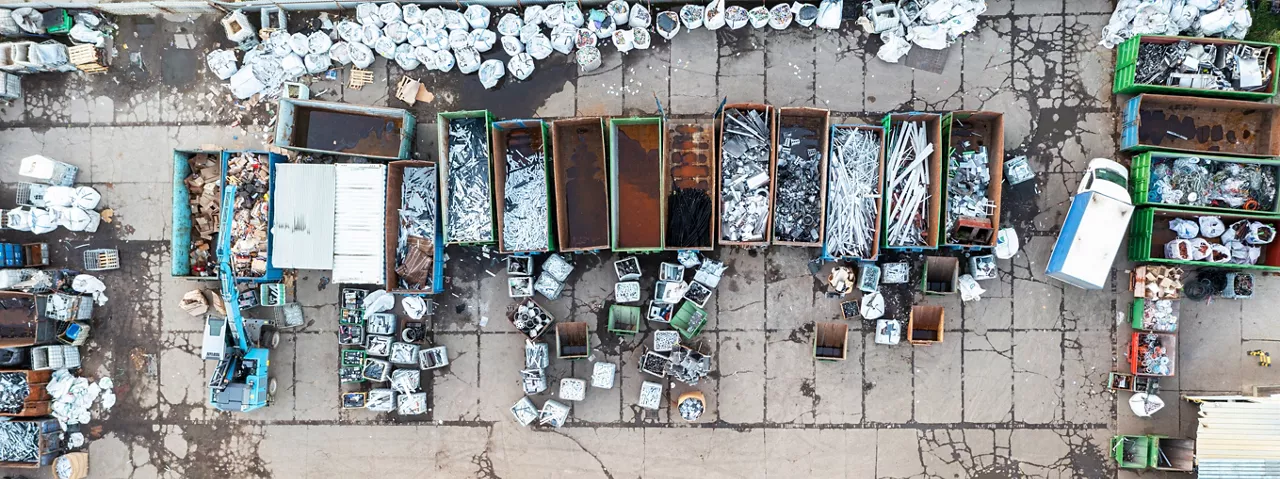 Containers from a height with different types of metal, Sorting for remelting metal products