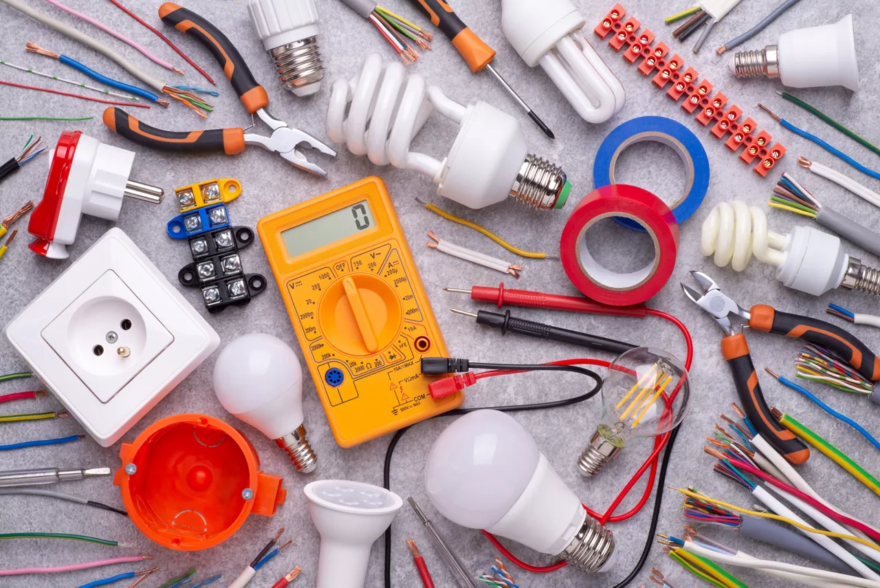 Electrician equipment on gray background, top view