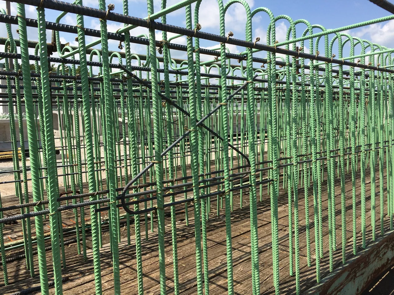 Reinforcement epoxy coated rebar used in concrete structures of precast beams,box culvert designs, concrete drainage items, pavement slabs as per materials specifications in heavy highway construction