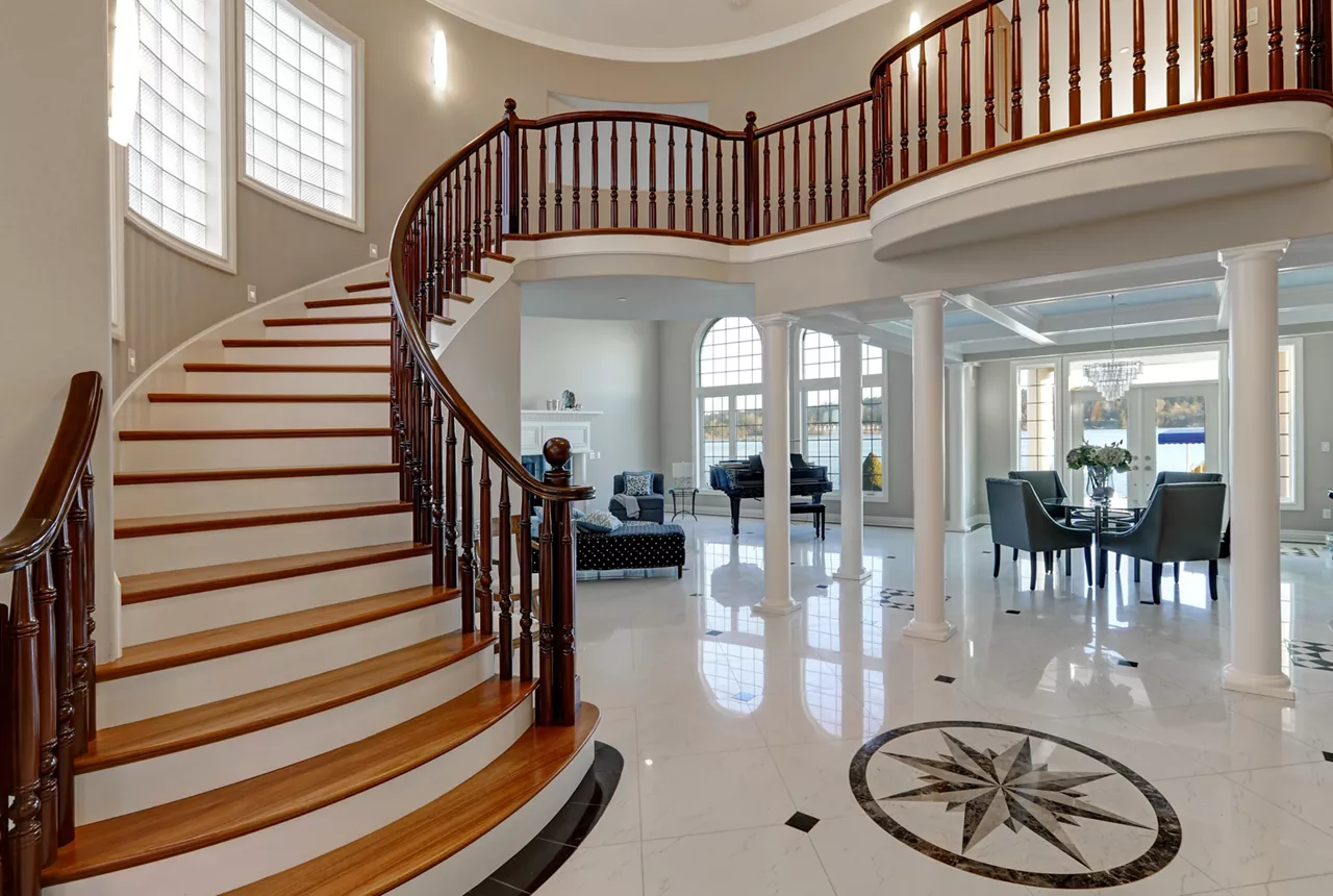 Stunning spacious two story entry foyer boasts marble mosaic tiled floor and grand staircase with glossy wood curved banister. The foyer flanked by formal dining room and living room. Northwest, USA