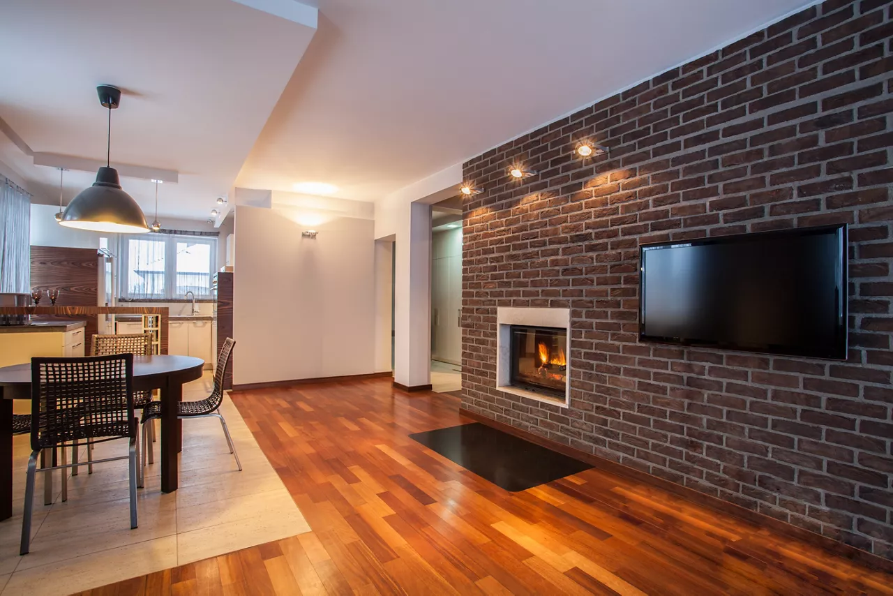 Country home - dining room with brick wall and fireplace