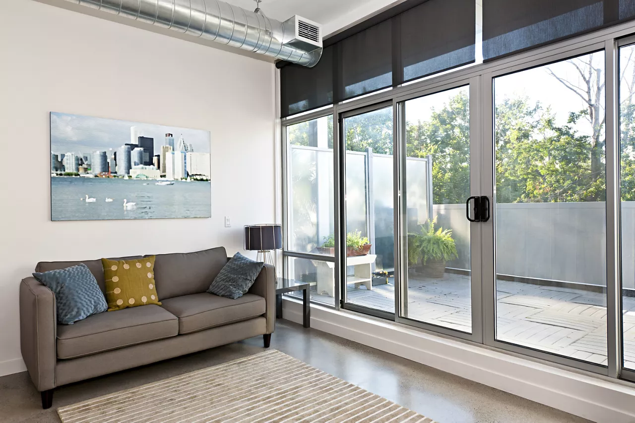 Living room with sliding glass door to balcony