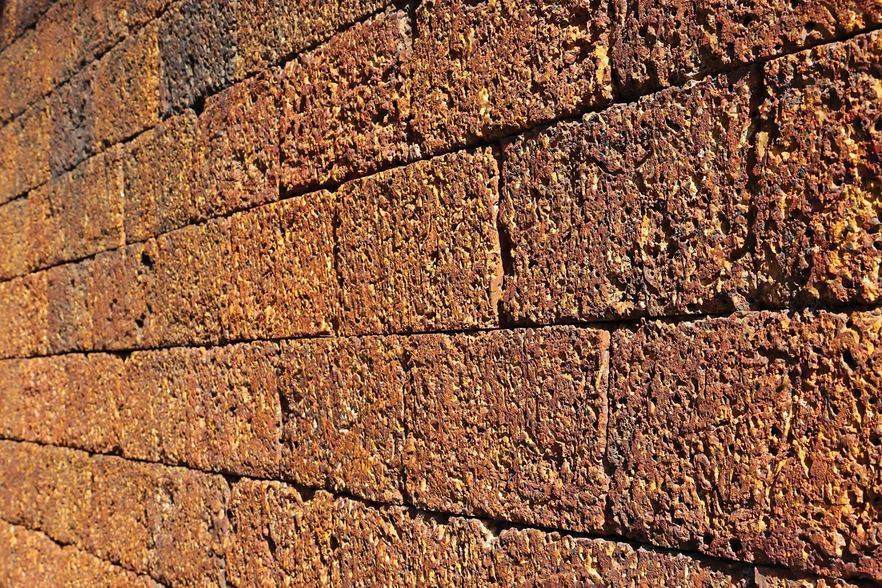 Laterite stone brick wall perspective texture background