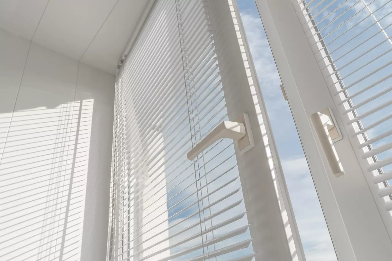 Open window. PVC plastic. Louver blinds.