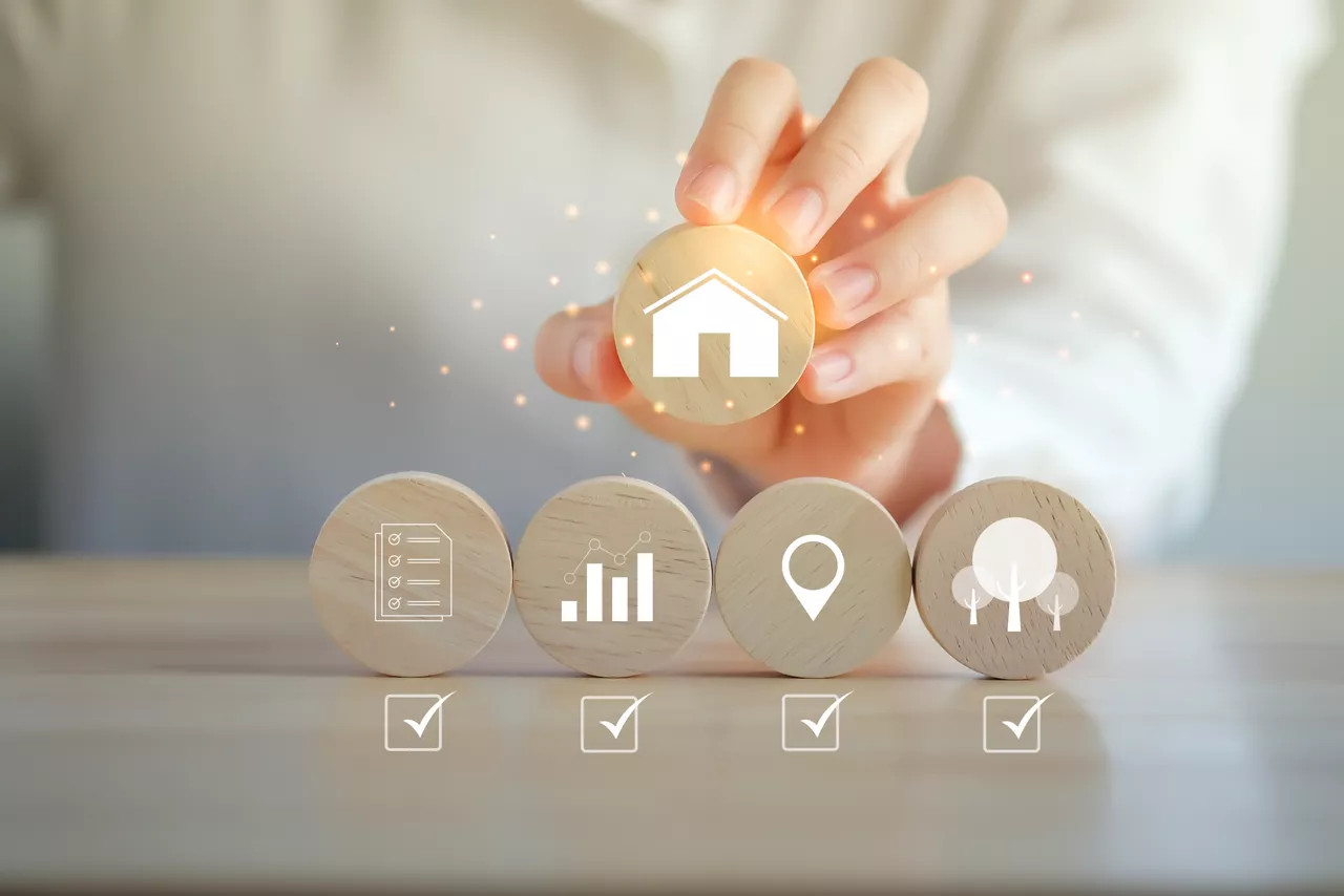 Real estate concept. Home buying check list. Check mark complete with quality, finance, location, facilities and environment for turn to home ownership. Hand holding house. property investment.