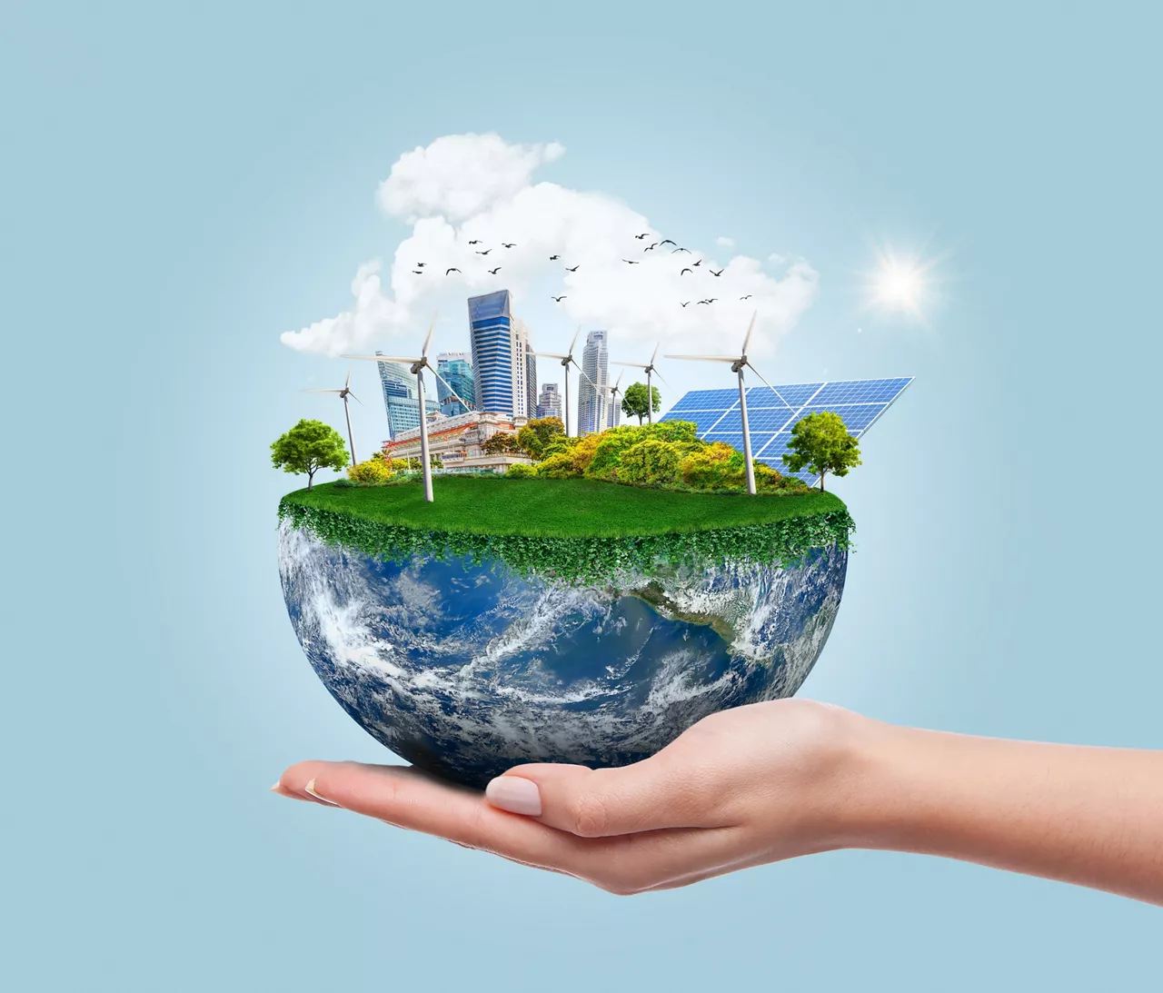 Planet earth with clean modern city relying on renewable resources. Environmental concept of alternative sustainable energy for an eco-friendly planet. Planet earth used with permission from NASA.