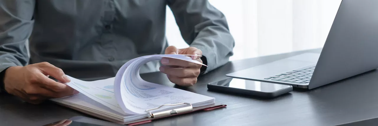 Businessman working with data spreadsheet documents at workplace