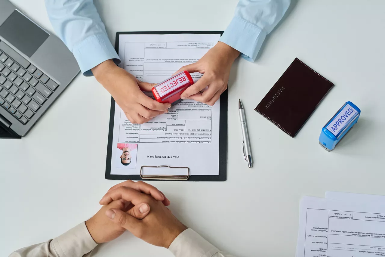 Specialist of visa center declining visa for tourist