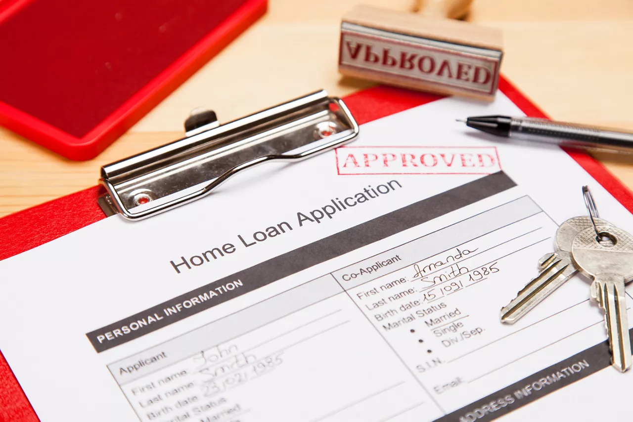 Approved home loan application form close-up photo