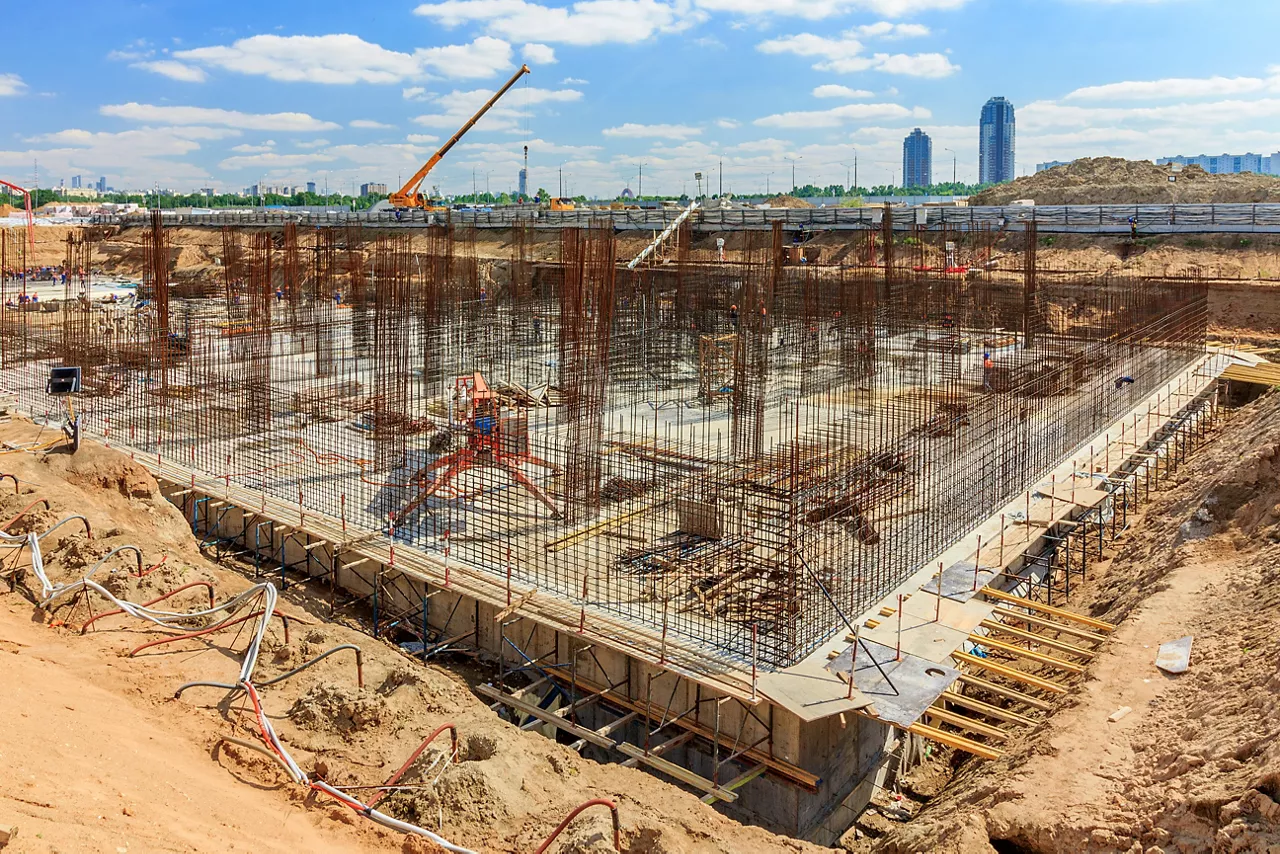 Pile field processing at mark. Panorama of pit. deep foundation is type of foundation that transfers building loads to earth farther down from surface than shallow foundation. subsurface layer