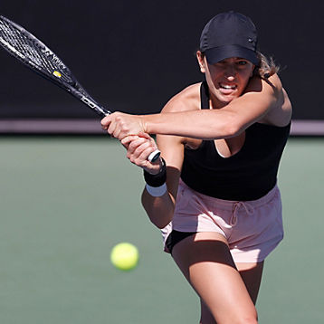 Alexandra Bozovic hits a tennis ball