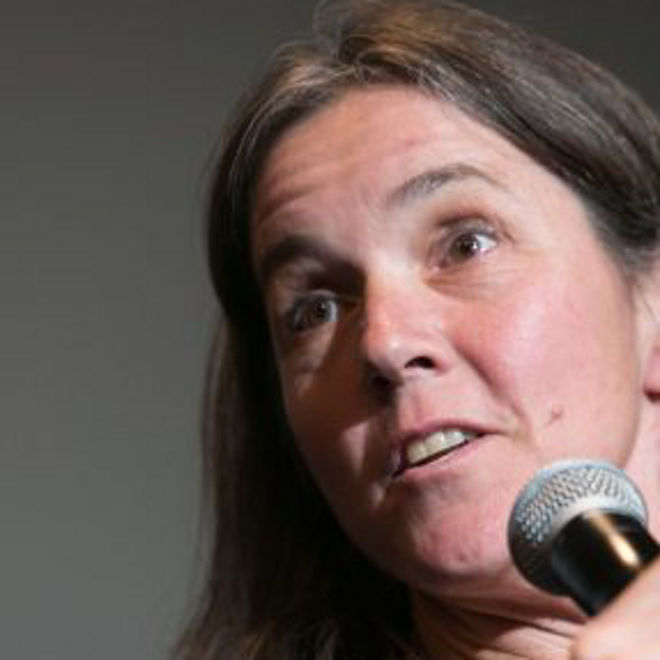 Anne Minter speaks at an event