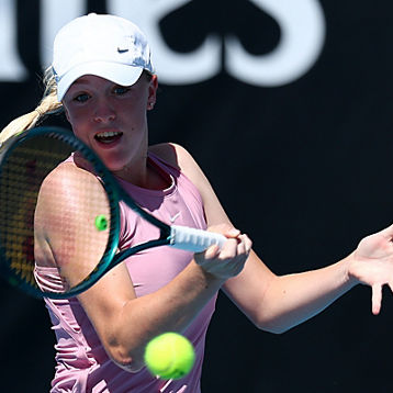 Ava Beck hits a forehand shot