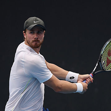 Blake Ellis take a backhand shot
