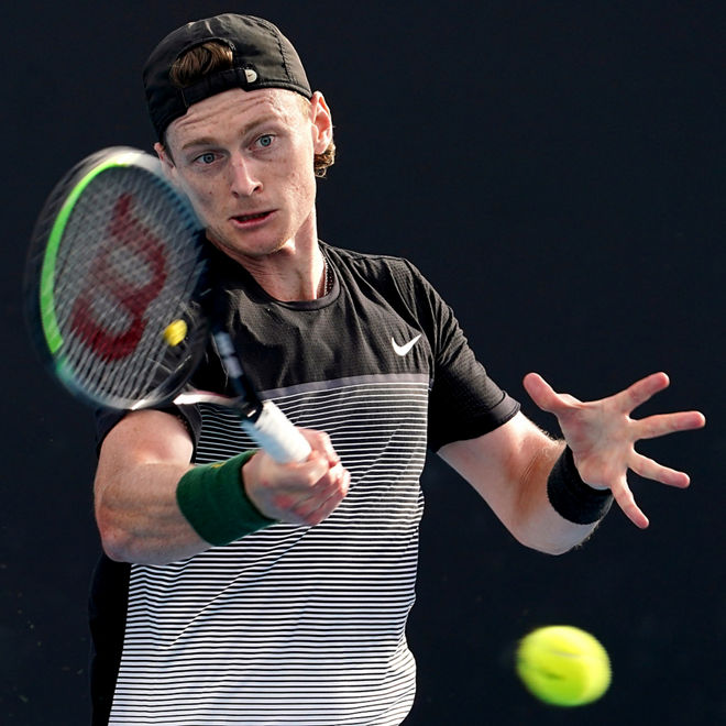 Blake Mott hits a forehand shot