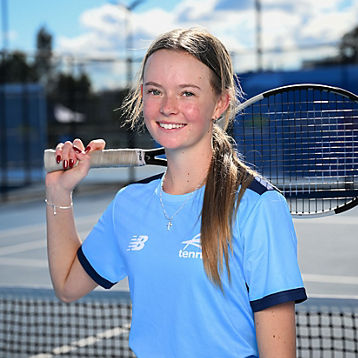 Brooke Komorowski poses with her tennis racquet