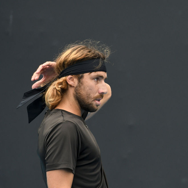 Calum Puttergill plays doubles tennis