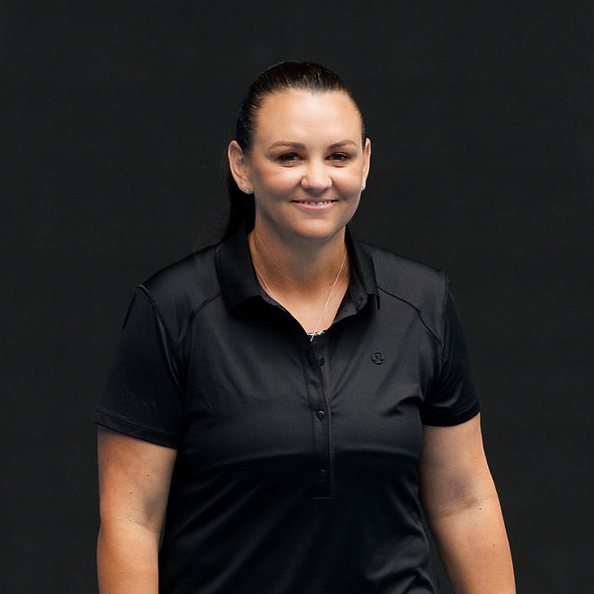 Casey Dellacqua smiles whilst playing tennis