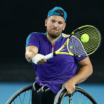 Dylan Alcott hits a tennis ball