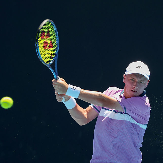 Edward Winter playing tennis