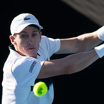 Gavin Van Peperzeel lines up a tennis ball fora shot