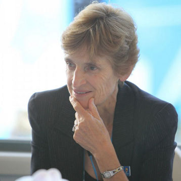 Janet Young listening at a tennis function