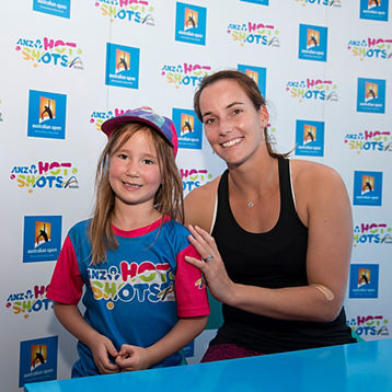 Jarmila Wolfe poses with a young tennis fan