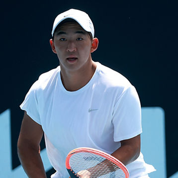Jeremy Jin  on court ready to play a shot
