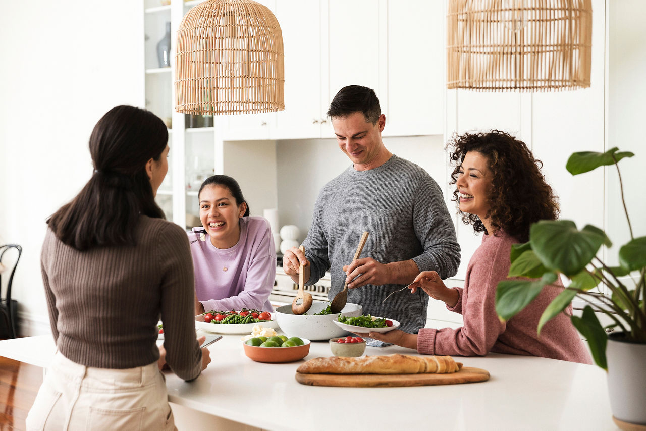 Family preparing meal in kitchen