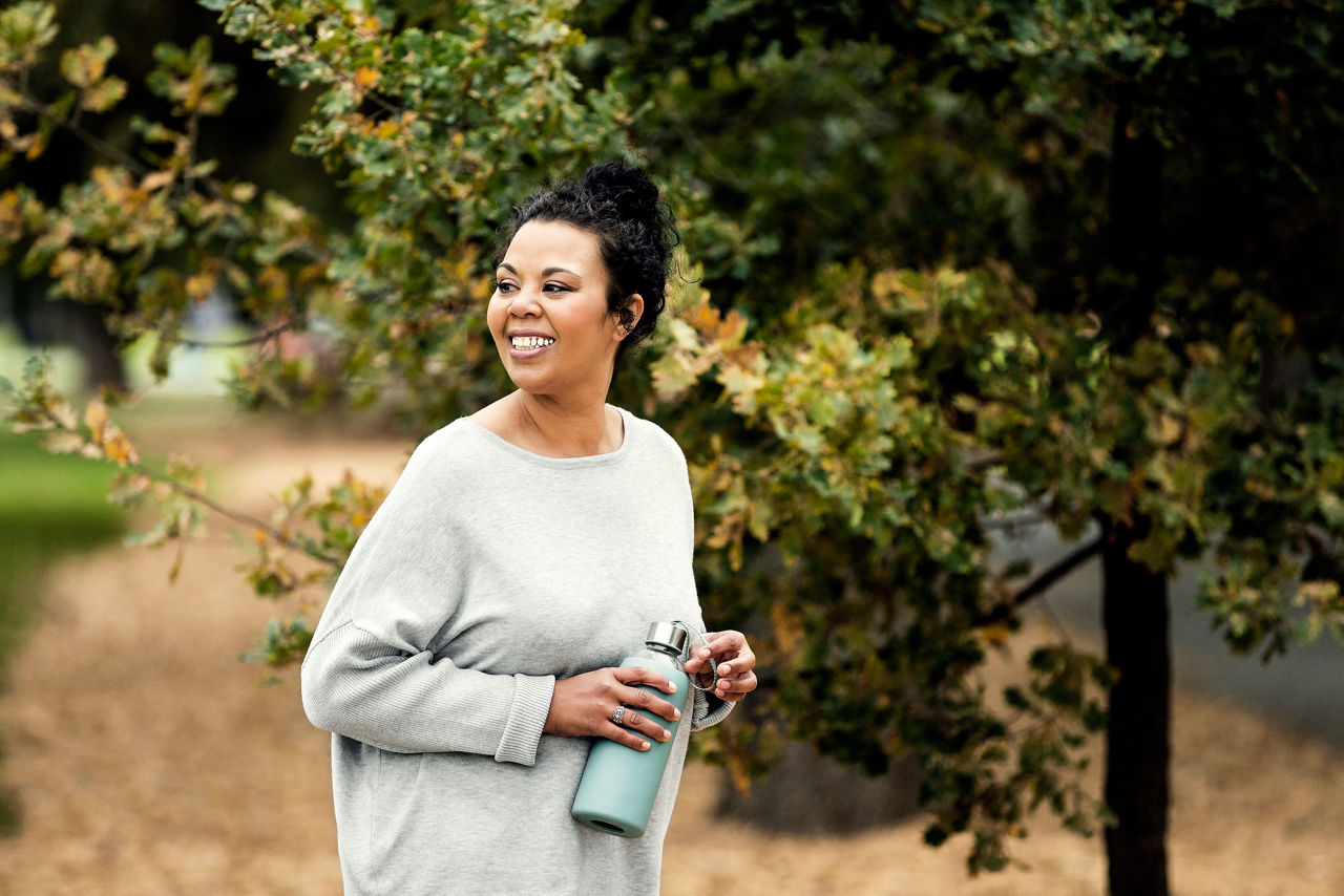 Woman in the park holding water bottle