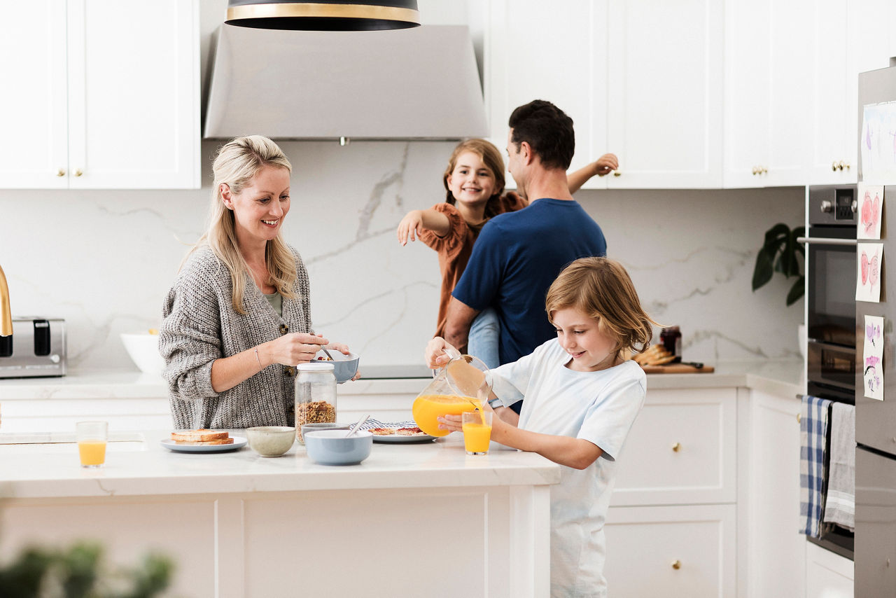 Family in the kitchen getting breakfast ready