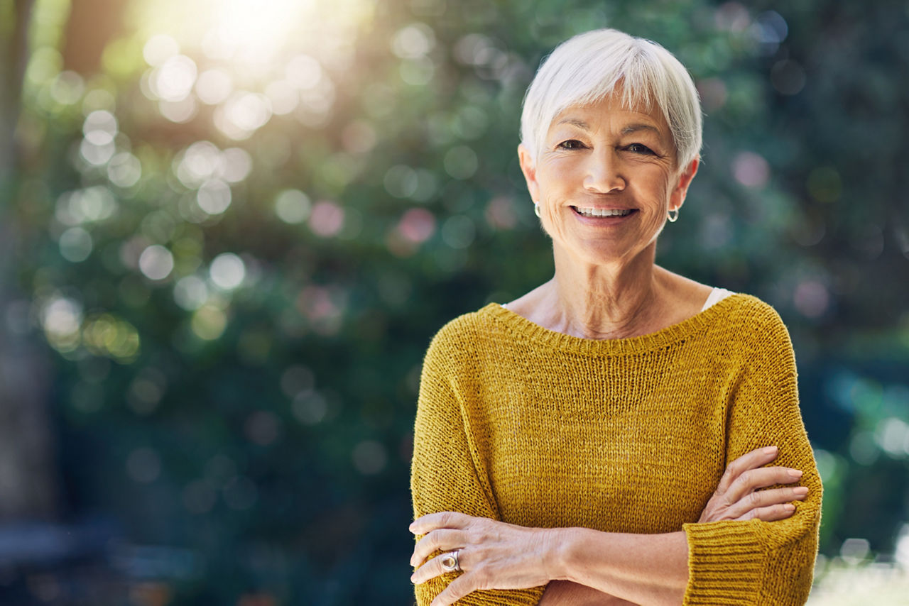 Shot of a happy senior woman standing outdoors