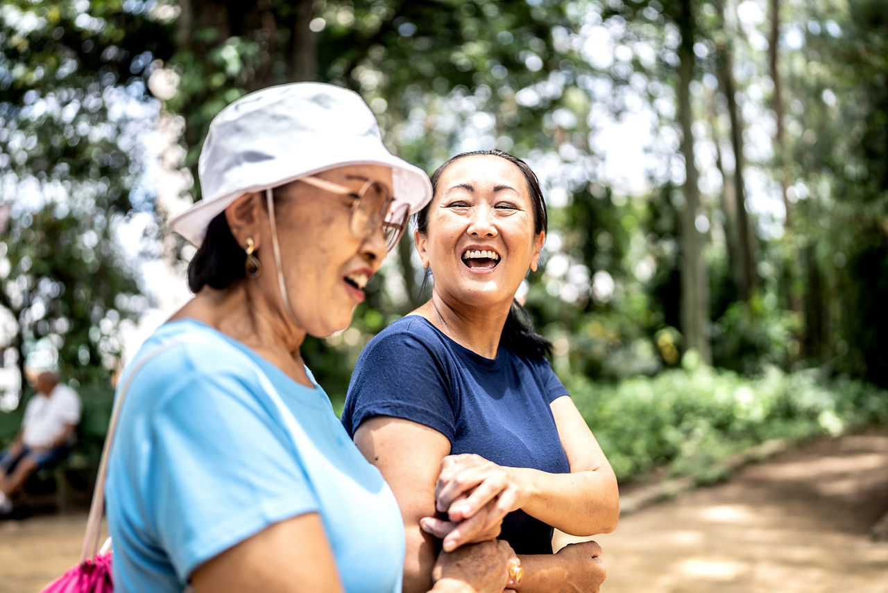 Mother and daughter talking on the public park