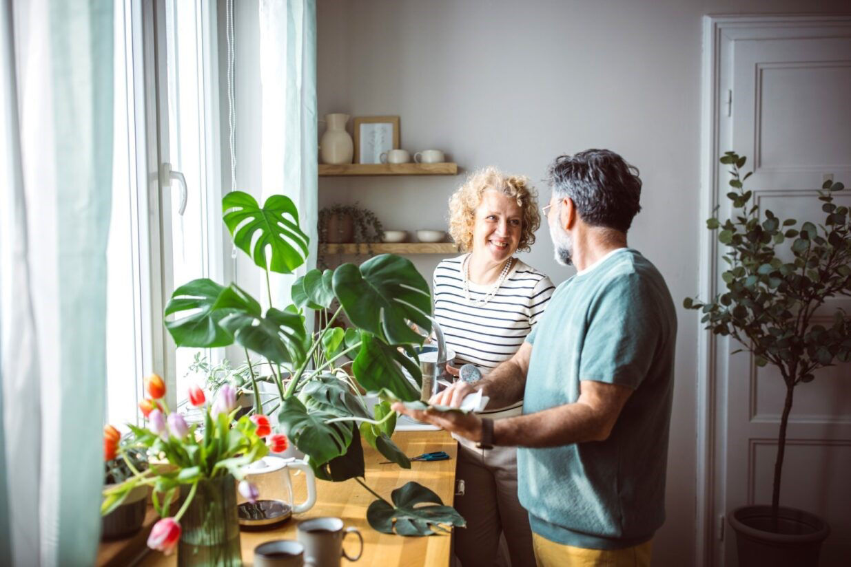 Couple tending to plant