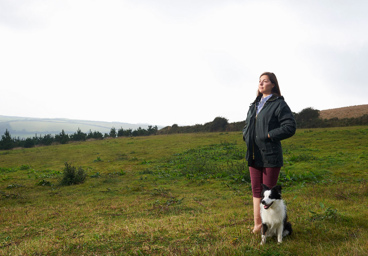 Woman on a farm with her dog