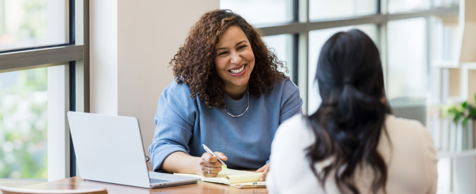 Two female employees discussing